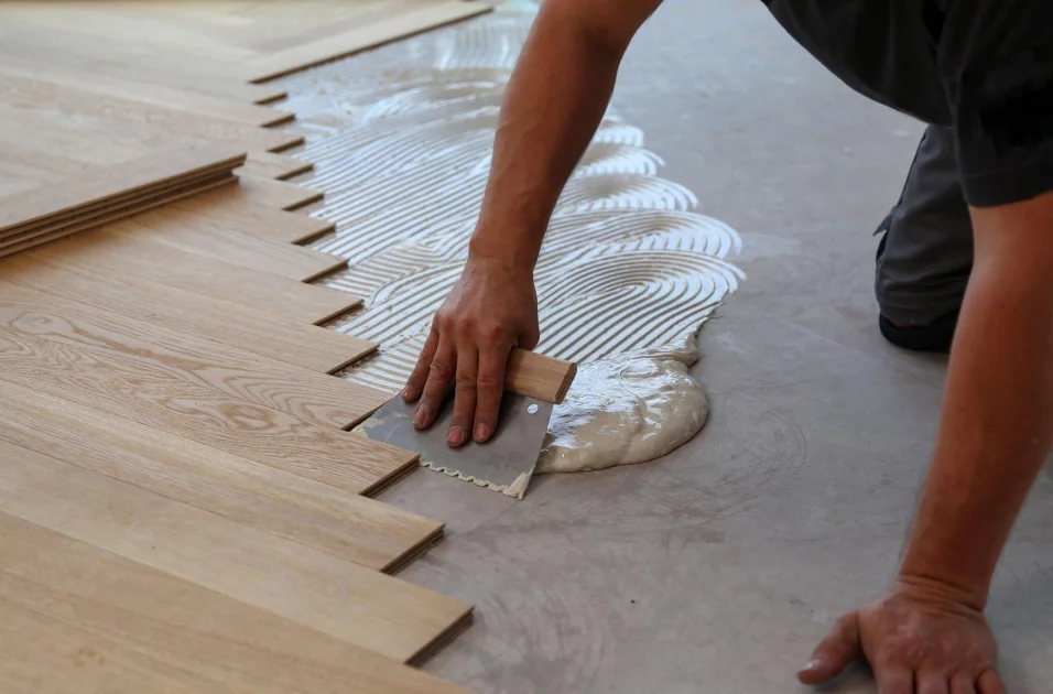 Flooring panels being installed over cement