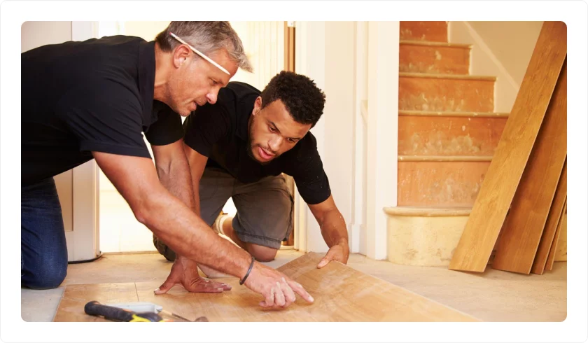 Customer looking at flooring installation with CRT Flooring representative